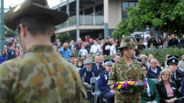 Dutton warns of war as thousands gather for post-restriction Anzac Day