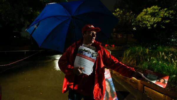 Paul Scully MP braces the rain to support wife Alison Byrnes